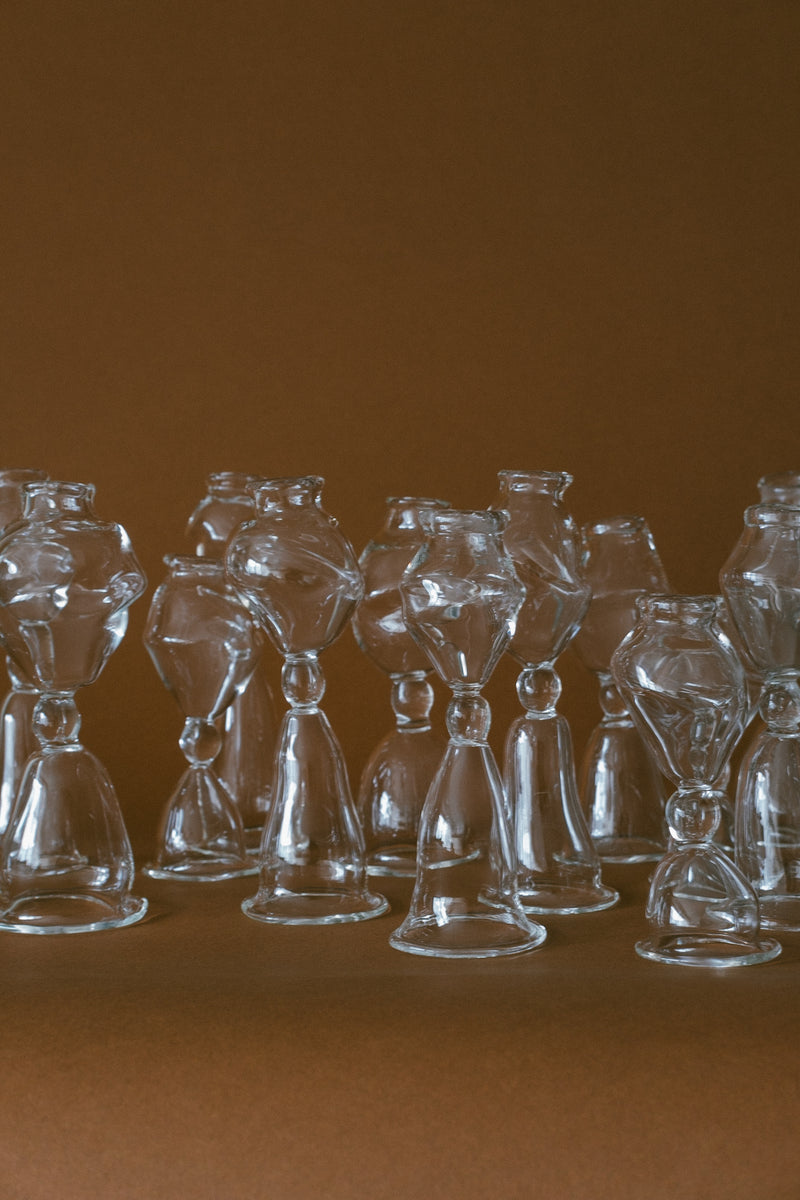 Set of three asymmetric glass candleholders